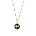 Black pendant necklace with gold bow and word remember on back