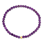 A beaded stretch bracelet made of faceted purple amethyst beads with a single small gold accent bead, shown on a plain white background.