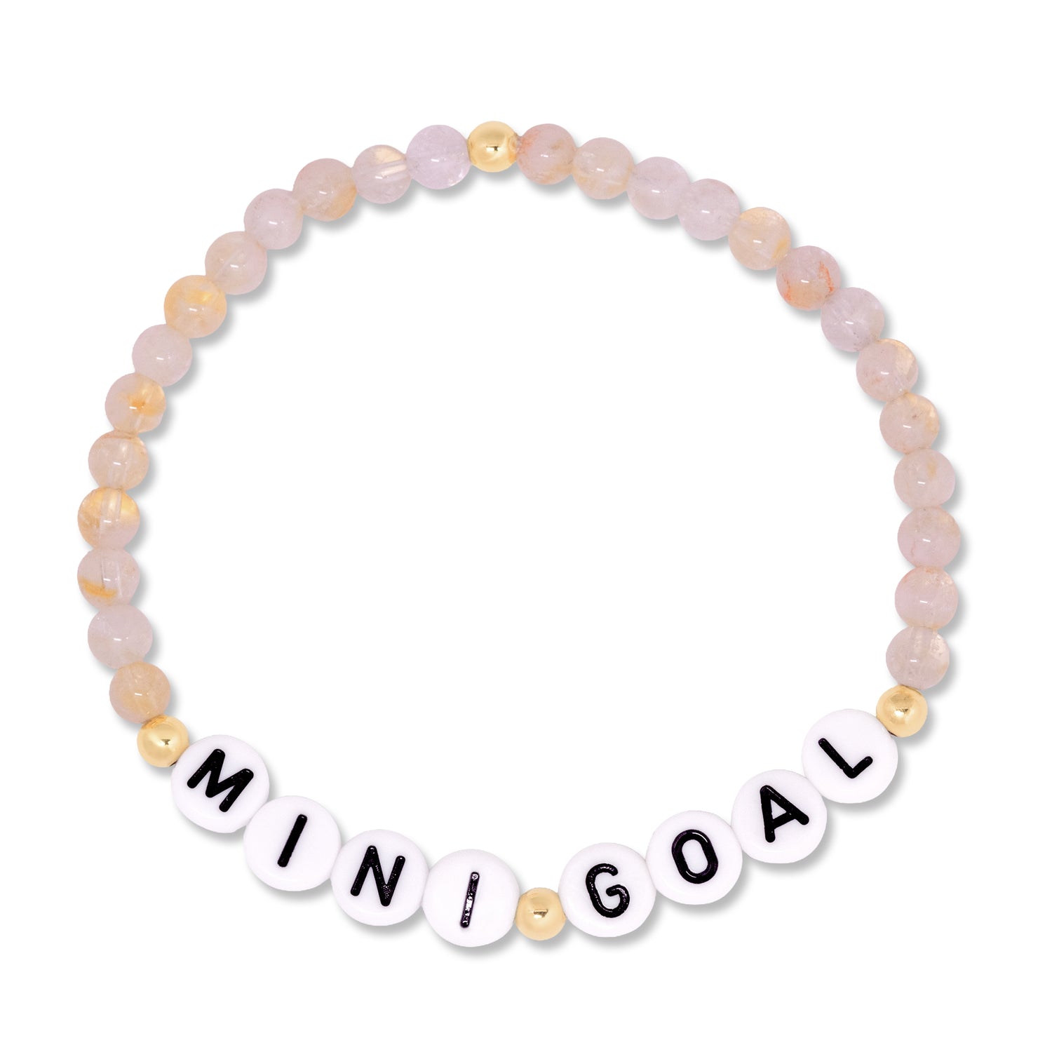 A beaded stretch bracelet featuring pale pink and peach stone beads, accented with small gold beads and white letter tiles spelling out 'MINI GOAL'.