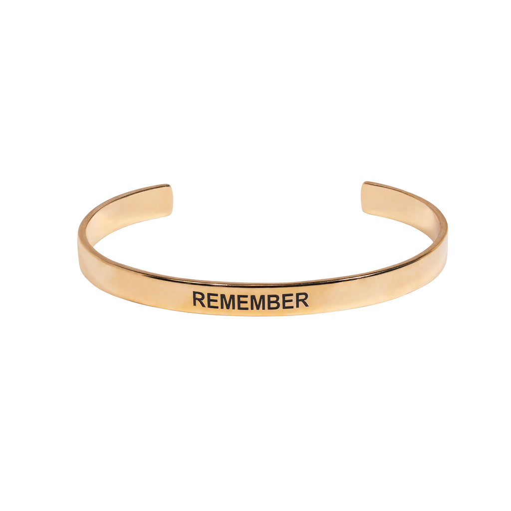 Gold cuff bracelet with word Remember on front