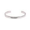 Silver cuff bracelet with word Remember on front